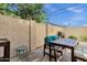 Backyard featuring high block fence, barbecue, and patio furniture on concrete at 3221 N 37Th St # 10, Phoenix, AZ 85018