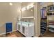 Contemporary bathroom featuring double vanity with glass countertop and access to a walk-in closet at 3221 N 37Th St # 10, Phoenix, AZ 85018