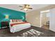 Bright bedroom featuring neutral walls, carpet flooring, ceiling fan and view to second floor at 3221 N 37Th St # 10, Phoenix, AZ 85018