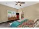 This spacious bedroom offers a dresser, tv and natural light with en-suite bathroom at 3221 N 37Th St # 10, Phoenix, AZ 85018