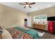 Bright bedroom boasts neutral paint, a ceiling fan, and natural lighting at 3221 N 37Th St # 10, Phoenix, AZ 85018