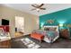 Comfortable bedroom with colorful bedding, a ceiling fan, and natural light at 3221 N 37Th St # 10, Phoenix, AZ 85018