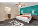 Bedroom showcasing an accent wall, ceiling fan and ensuite bathroom at 3221 N 37Th St # 10, Phoenix, AZ 85018