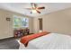 Bedroom featuring carpet floor, neutral walls, built-in bookshelf and ensuite bathroom at 3221 N 37Th St # 10, Phoenix, AZ 85018