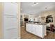 Open floor plan features a kitchen island with white cabinets and drawers at 3221 N 37Th St # 10, Phoenix, AZ 85018