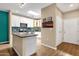 Kitchen with white cabinets, an island, and stainless steel appliances at 3221 N 37Th St # 10, Phoenix, AZ 85018