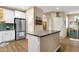 Kitchen with white cabinets, stainless steel appliances, and center island at 3221 N 37Th St # 10, Phoenix, AZ 85018