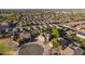 Aerial shot of a beautiful home nestled in a well-maintained neighborhood with mature trees and landscaping at 32311 N Cat Hills Ave, San Tan Valley, AZ 85144
