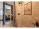 Elegant bathroom with a beautifully tiled shower, upscale fixtures, and seamless open doorway design at 32311 N Cat Hills Ave, San Tan Valley, AZ 85144
