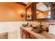Double sinks and decorative mirrors highlight this lovely bathroom at 32311 N Cat Hills Ave, San Tan Valley, AZ 85144