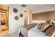Bedroom featuring a stylish bed, coordinated decor, and an open doorway enhancing the living experience at 32311 N Cat Hills Ave, San Tan Valley, AZ 85144