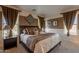 Charming bedroom with a plush bed, elegant decor, and plenty of natural light creating a serene retreat at 32311 N Cat Hills Ave, San Tan Valley, AZ 85144