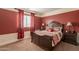 Comfortable bedroom with a queen-sized bed and matching nightstands at 32311 N Cat Hills Ave, San Tan Valley, AZ 85144