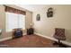 Inviting bedroom featuring neutral tones, plush carpet, and charming decor for a cozy ambiance at 32311 N Cat Hills Ave, San Tan Valley, AZ 85144