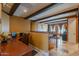 Versatile living space with exposed beams, built-in shelving, and comfortable seating area at 32311 N Cat Hills Ave, San Tan Valley, AZ 85144
