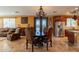 Open floor plan features a dining area, and seamless flow to the living room and kitchen at 32311 N Cat Hills Ave, San Tan Valley, AZ 85144