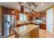 Modern kitchen features stainless steel appliances, granite countertops, and ample cabinet space at 32311 N Cat Hills Ave, San Tan Valley, AZ 85144