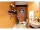 Stylish powder room boasts unique vessel sink, decorative shelf, and elegant accents at 32311 N Cat Hills Ave, San Tan Valley, AZ 85144