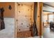 Custom shower features decorative tile, stone flooring, and convenient shelving at 32311 N Cat Hills Ave, San Tan Valley, AZ 85144