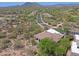 Desert home has a patio and outdoor fireplace with gorgeous mountain views at 32516 N 68Th Pl, Scottsdale, AZ 85266