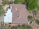 Aerial view shows the roof of the home, patio, and desert landscaping at 32516 N 68Th Pl, Scottsdale, AZ 85266