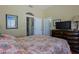 Bright bedroom with large bed and desert view from the windows at 32516 N 68Th Pl, Scottsdale, AZ 85266