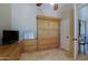 Bedroom with a ceiling fan and custom wooden cabinet at 32516 N 68Th Pl, Scottsdale, AZ 85266