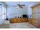 Bedroom with a ceiling fan and custom wooden cabinet at 32516 N 68Th Pl, Scottsdale, AZ 85266