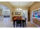 This dining room features a coffered ceiling and opens to the living room at 32516 N 68Th Pl, Scottsdale, AZ 85266