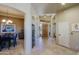 Inviting entryway with travertine flooring, archways, and a wine rack at 32516 N 68Th Pl, Scottsdale, AZ 85266