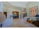 Inviting foyer featuring natural light, tile floors, and views into the dining and living spaces at 32516 N 68Th Pl, Scottsdale, AZ 85266