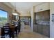 Eat-in kitchen with views, stainless appliances, tile backsplash and custom cabinets at 32516 N 68Th Pl, Scottsdale, AZ 85266