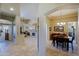Open living spaces feature travertine floors, a fireplace, and a dining area at 32516 N 68Th Pl, Scottsdale, AZ 85266