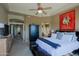 Spacious main bedroom with a ceiling fan and a view of the Primary bathroom at 32516 N 68Th Pl, Scottsdale, AZ 85266