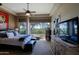 Bright and airy main bedroom with a ceiling fan and backyard views at 32516 N 68Th Pl, Scottsdale, AZ 85266