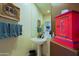 Colorful powder room featuring decorative accents and a pedestal sink at 32516 N 68Th Pl, Scottsdale, AZ 85266
