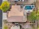 An aerial view shows a home with a private pool, spa, putting green and outdoor living spaces at 3859 N El Sereno St, Mesa, AZ 85207