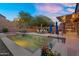 Backyard pool with steps, built-in spa, patio seating, and an outdoor kitchen area at 3859 N El Sereno St, Mesa, AZ 85207