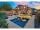 Expansive backyard featuring a swimming pool, spa, dining area, and outdoor entertaining spaces at 3859 N El Sereno St, Mesa, AZ 85207