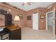 Spacious bedroom featuring dark wood desk and salmon color walls with decorative fishing decor at 3859 N El Sereno St, Mesa, AZ 85207