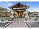 Luxurious spa and fitness center entrance with a porte-cochere and manicured landscaping at 3859 N El Sereno St, Mesa, AZ 85207