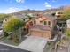 Beautiful home showcases a well-maintained exterior, three-car garage, and attractive desert landscaping at 3859 N El Sereno St, Mesa, AZ 85207