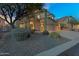 Beautiful two-story home with desert landscaping and a spacious three-car garage, perfect for Gathering living at 3859 N El Sereno St, Mesa, AZ 85207