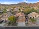 Stunning aerial view of a home with mature landscaping, a three-car garage, and great curb appeal at 3859 N El Sereno St, Mesa, AZ 85207
