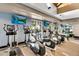 Bright fitness center featuring modern cardio equipment and mounted televisions for resident use and enjoyment at 3859 N El Sereno St, Mesa, AZ 85207