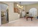 Spacious game room with a pool table and staircase, ideal for entertainment and Gathering gatherings at 3859 N El Sereno St, Mesa, AZ 85207