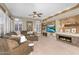 Inviting living room with a cozy fireplace, plush seating, and stylish decor for relaxation and comfort at 3859 N El Sereno St, Mesa, AZ 85207