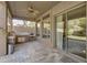 Covered patio with outdoor kitchen, ceiling fan, and large sliding glass doors to the interior at 3859 N El Sereno St, Mesa, AZ 85207