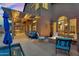 Well-appointed patio includes seating, dining area, fire pit, and grill, perfect for outdoor gatherings at 3859 N El Sereno St, Mesa, AZ 85207