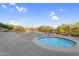 Relaxing community pool with a hot tub surrounded by desert landscaping and shaded cabanas at 3859 N El Sereno St, Mesa, AZ 85207